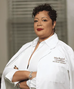 Dr. C. Nicole Swiner, MD in her Black Girl Vitamins medical advisor coat